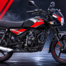 Bajaj CT 110X black and red commuter motorcycle with sporty graphics in a futuristic neon-lit studio background